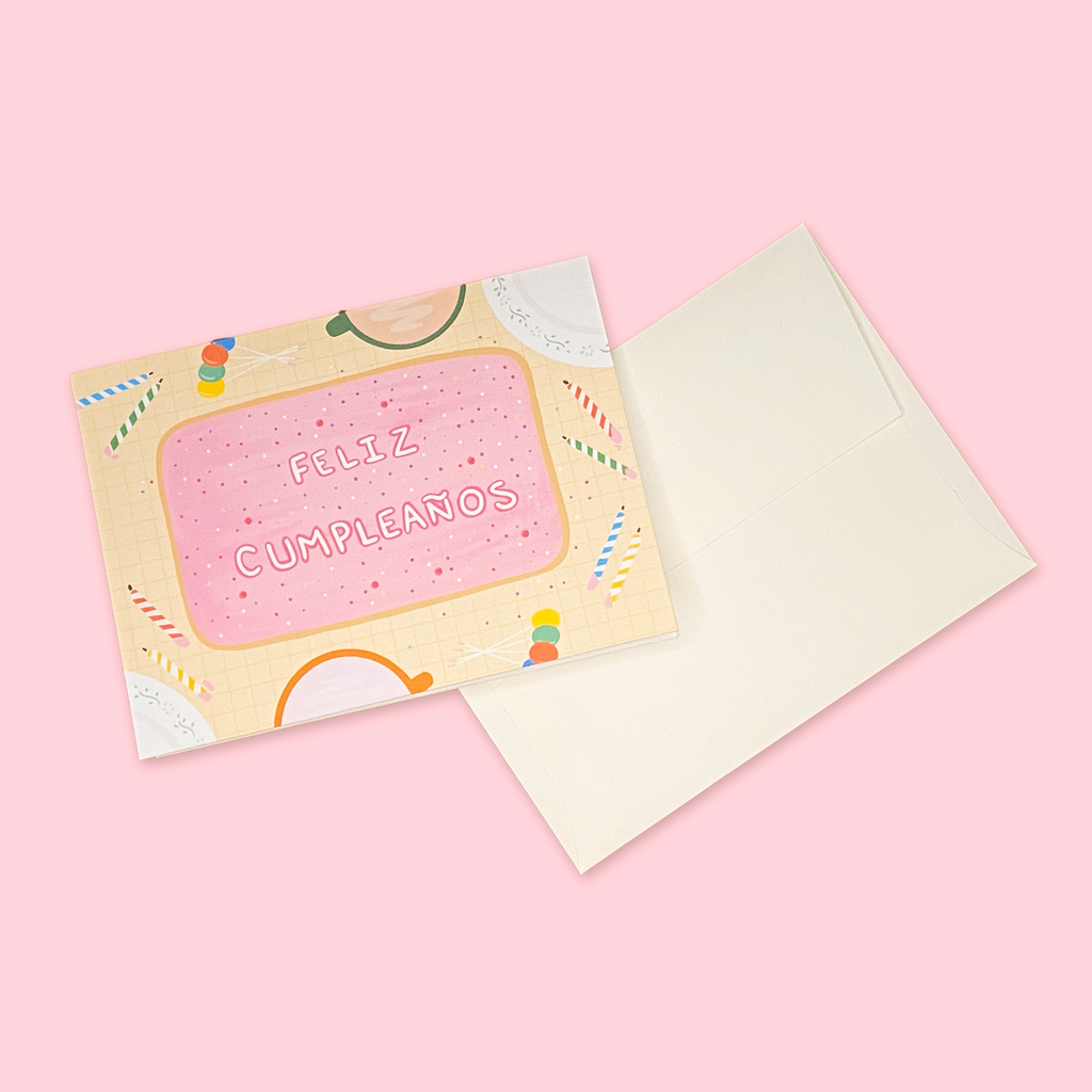 "En La Mesa Pastel" greeting card next to creme colored envelope.