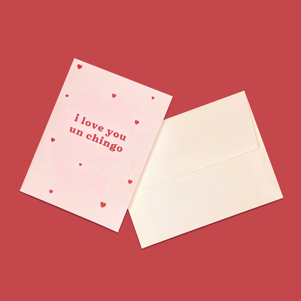 "I Love You Un Chingo" greeting card next to creme colored envelope.